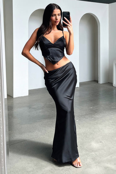 Sultry black maxi skirt with bare shoulders